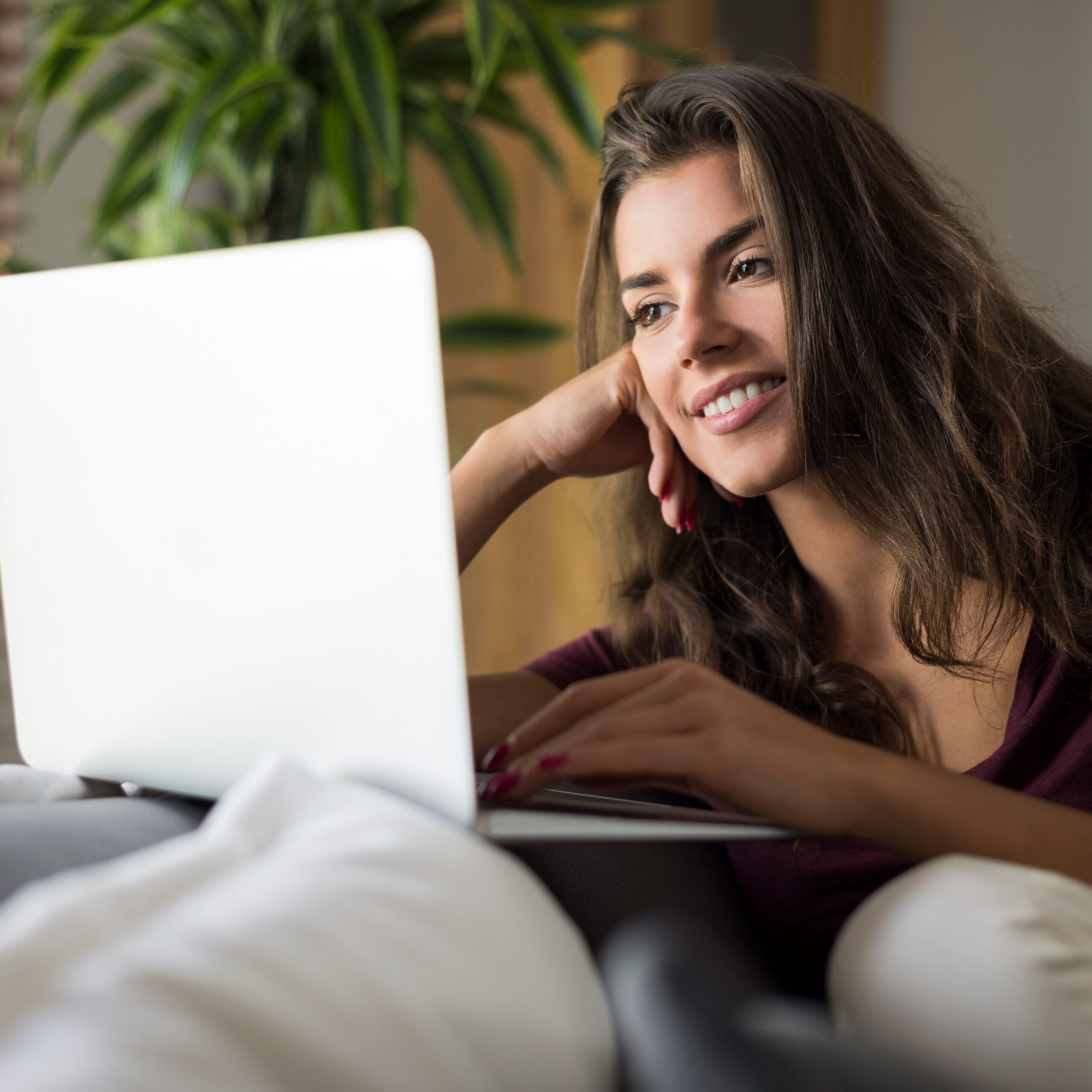 happy-beautiful-young-woman-with-laptop-computer-at-home-1